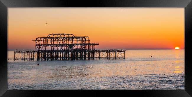 Old Brighton Pier in the sunset Framed Print by Erik Lattwein