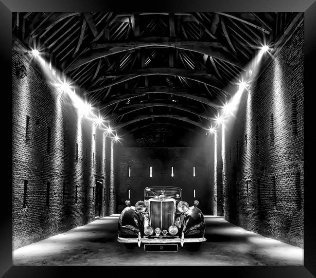 Classic MG lit up in a barn Framed Print by Simon Marlow