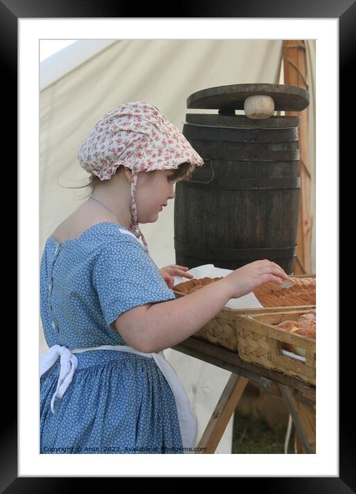 Woman baking bread, Civil War Reenactment; girl at counter Framed Mounted Print by Arun 