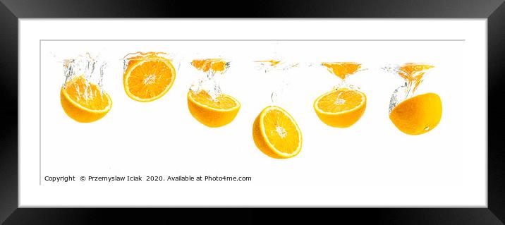 Orange halves splashing into water panorama shoot Framed Mounted Print by Przemek Iciak