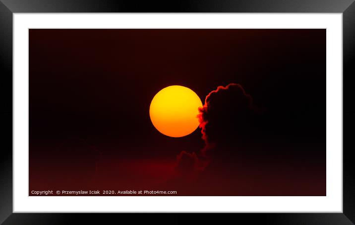 Sunset against reddish sky with back lit cloud Framed Mounted Print by Przemek Iciak