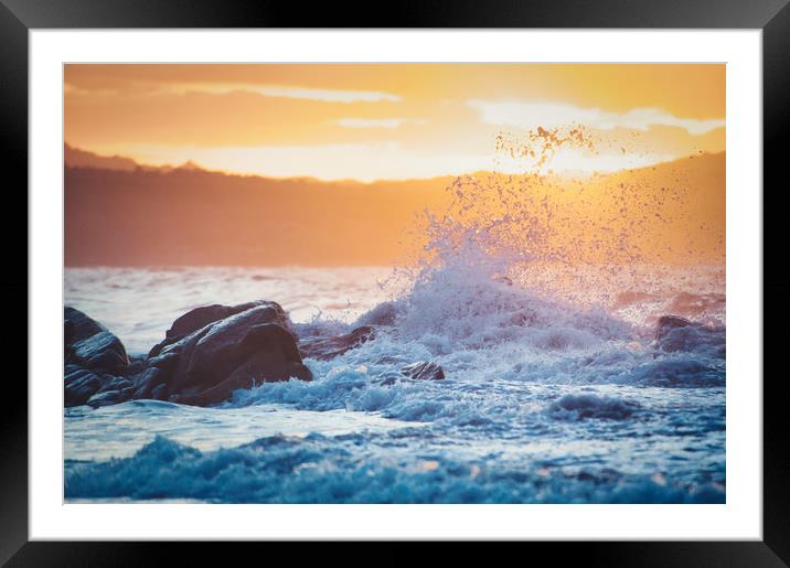 wave breaking on the rocks at sunset Framed Mounted Print by federico stevanin