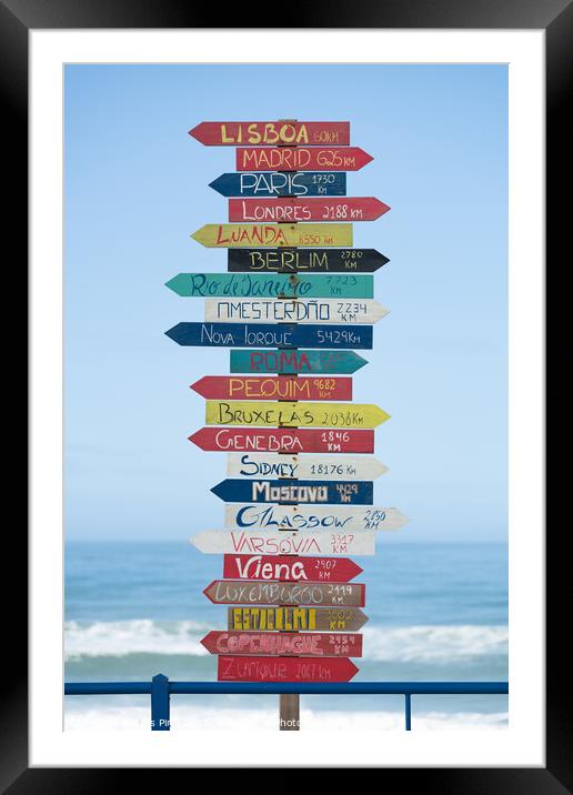 Indication arrows to cities around the world in Torres Vedras, Portugal Framed Mounted Print by Luis Pina