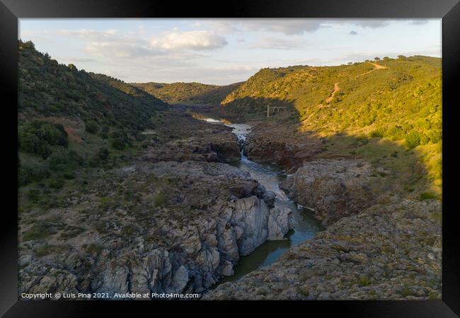 Pulo do Lobo waterfall drone aerial view with river guadiana and beautiful green valley landscape at sunset in Mertola Alentejo, Portugal Framed Print by Luis Pina