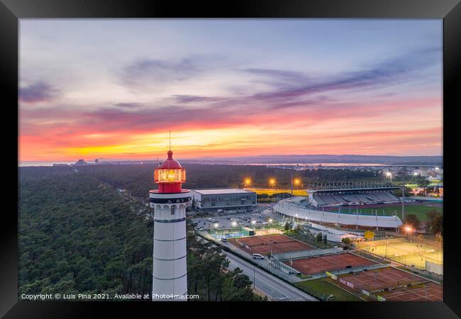 Aerial drone view of Vila Real de Santo Antonio city, lighthouse farol and stadium in Portugal, at sunset Framed Print by Luis Pina