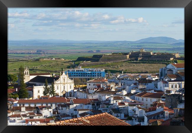 Elvas city inside the fortress wall in Alentejo with Santa Luzia fortress on the background, Portugal Framed Print by Luis Pina