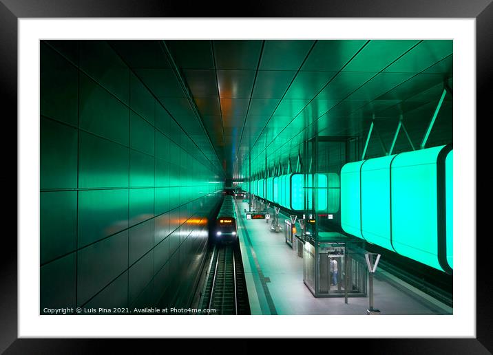 Train at the Subway station with green lights at University on the Speicherstadt area in Hamburg Framed Mounted Print by Luis Pina