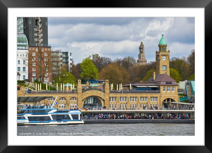 View of St. Pauli's Pier Landungsbrücken station tower with buildings and boats in Hamburg Framed Mounted Print by Luis Pina