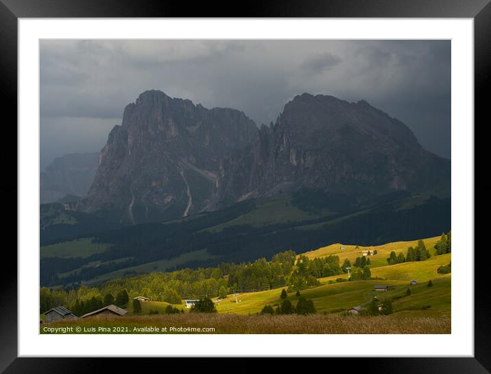 Sassolungo mountains on the Italian Alps Dolomites on the shadow with the sunlight appearing on the landscape Framed Mounted Print by Luis Pina