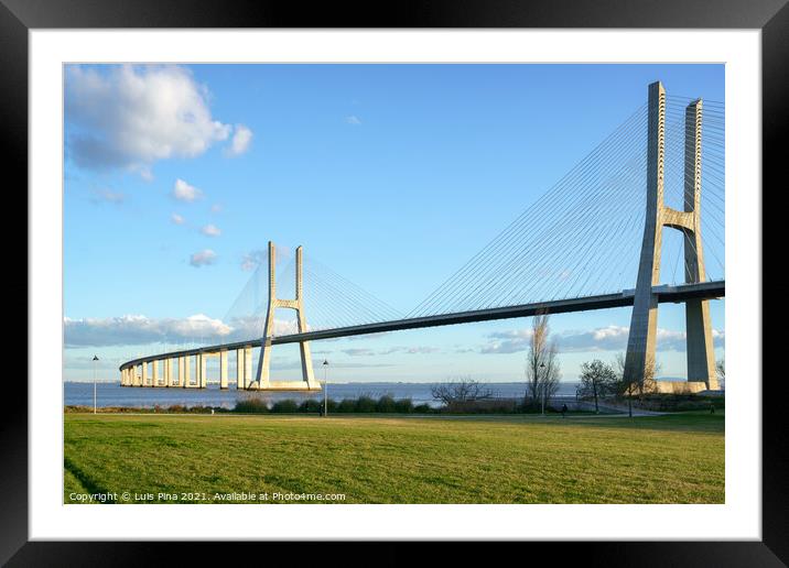 Ponte Vasco da Gama Bridge view from a garden park during the day Framed Mounted Print by Luis Pina