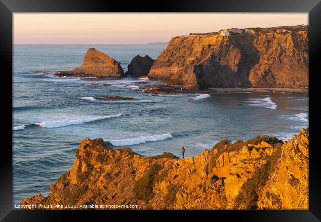 Woman on a cliff at Praia de Odeceixe in Costa Vicentina, Portugal Framed Print by Luis Pina