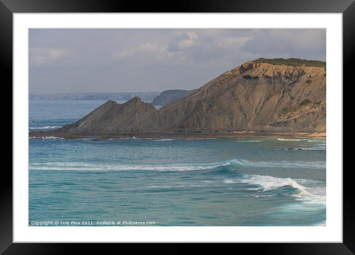 Aljezur beach with waves crashing and sea cliffs on the background Framed Mounted Print by Luis Pina