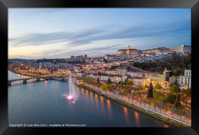 Coimbra drone aerial city view at sunset with colorful fountain in Mondego river and beautiful historic buildings, in Portugal Framed Print by Luis Pina