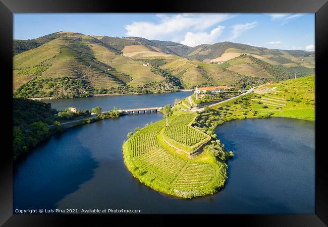 Douro wine valley region drone aerial view of s shape bend river in Quinta do Tedo at sunset, in Portugal Framed Print by Luis Pina