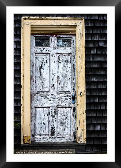 Old wooden door with weathered paint Framed Mounted Print by Miro V