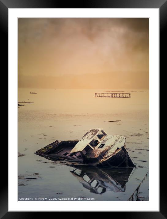 Old boat in water with dramatic storm sky Framed Mounted Print by Miro V
