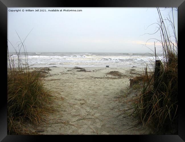 Walking on to an angry Atlantic beach Framed Print by William Jell