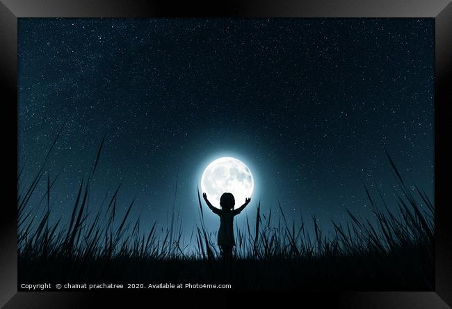 Girl holding the moon in starry night,3d rendering Framed Print by chainat prachatree