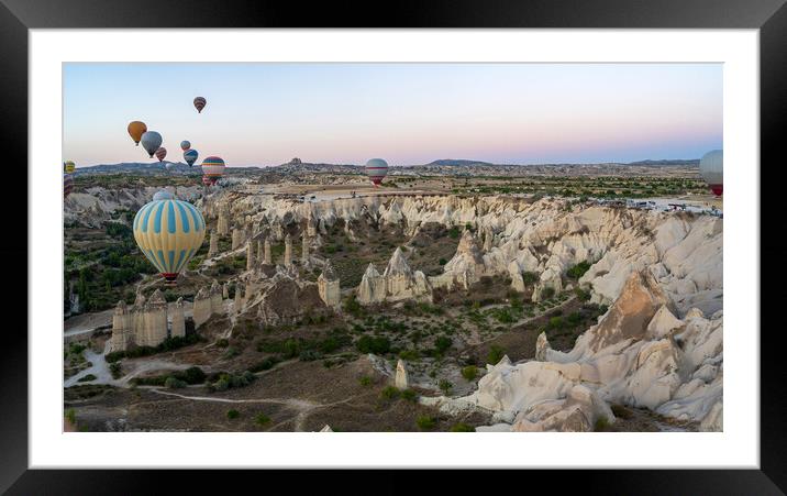 Hot Air balloons flying tour over Mountains landscape geological rock formation in autumn during sunrise in Cappadocia, Goreme National Park, Turkey nature background Framed Mounted Print by Arpan Bhatia