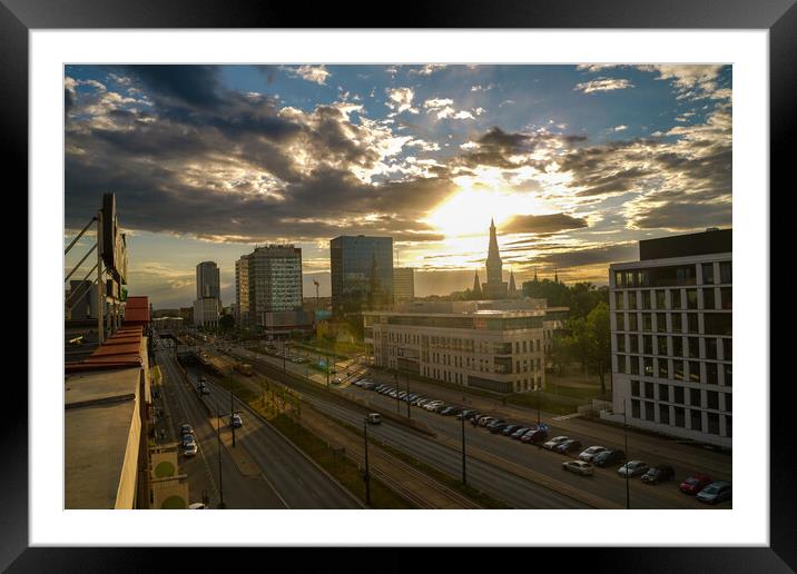 Wide angle aerial view of Lodz cityscape with mix of modern and medieval architecture next to highway against dramatic sunset Framed Mounted Print by Arpan Bhatia