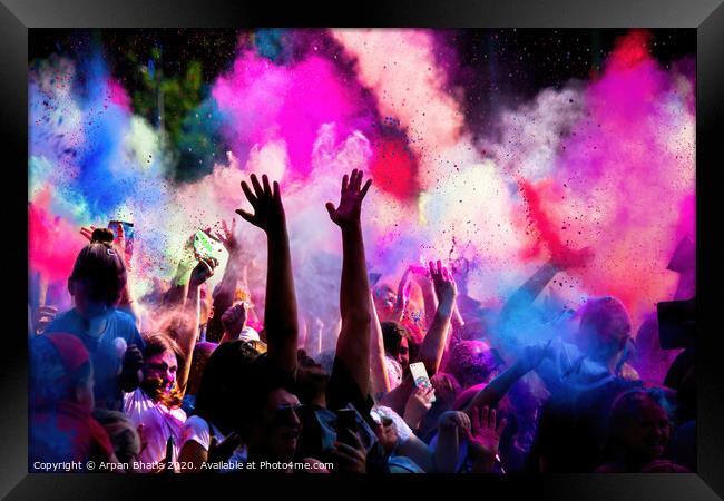 Krakow, Poland - August 25, 2019: Unidentified people playing with colors during hindu festival holi. Hands are visible throwing colors in the air Framed Print by Arpan Bhatia