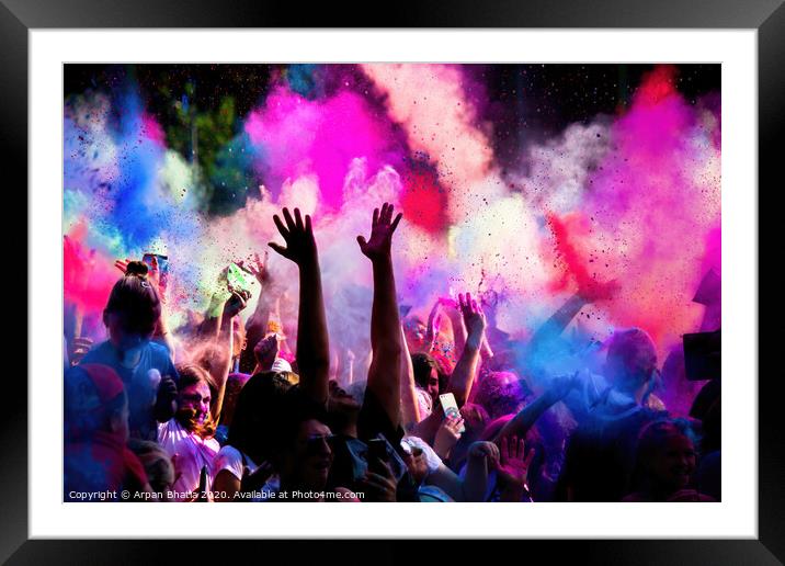Krakow, Poland - August 25, 2019: Unidentified people playing with colors during hindu festival holi. Hands are visible throwing colors in the air Framed Mounted Print by Arpan Bhatia
