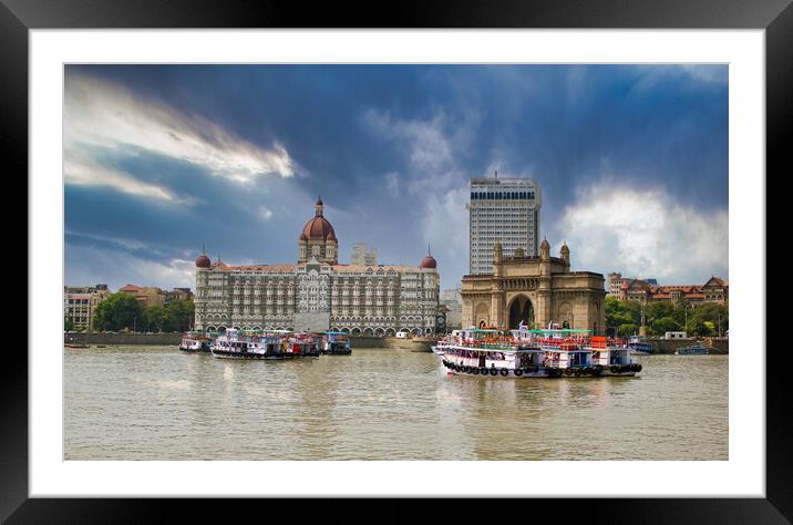 Mumbai, India: Wide angle shot of Gateway of India and Taj hotel against sea and dramatic cloudy sky Framed Mounted Print by Arpan Bhatia