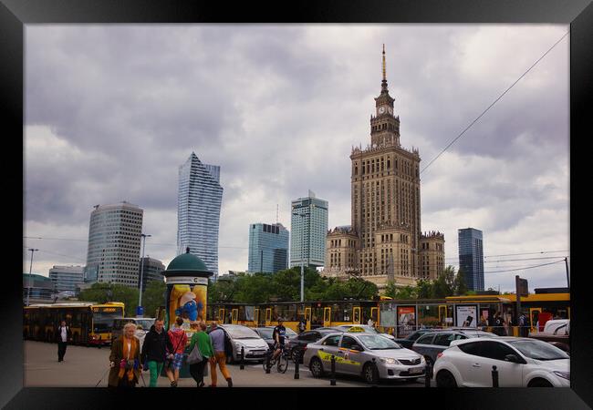 Warsaw, Poland - June 01, 2017: Cityscape showing people and traffic against Palace of Culture and sciences one of the main travel attractions, symbol of Warsaw city located in central Europe Framed Print by Arpan Bhatia