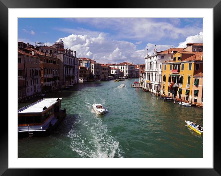 Venice, Italy: View of a canal with boats between italian architecture against dramatic clouds Framed Mounted Print by Arpan Bhatia