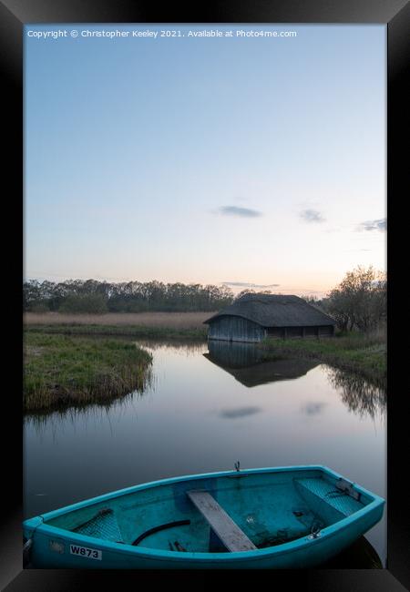 Reflections and boat at Hickling Broad Framed Print by Christopher Keeley