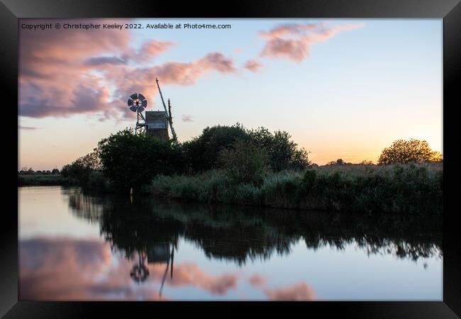 Sunset reflections at How Hill windmill Framed Print by Christopher Keeley
