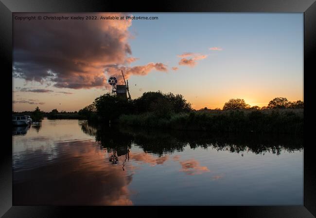 Norfolk Broads windmill sunset Framed Print by Christopher Keeley