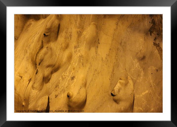 Gnomes or trolls on golden yellow cave wall. Framed Mounted Print by Hanif Setiawan