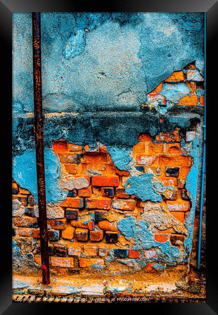 A damaged brick wall in digital brown turquoise bl Framed Print by Hanif Setiawan