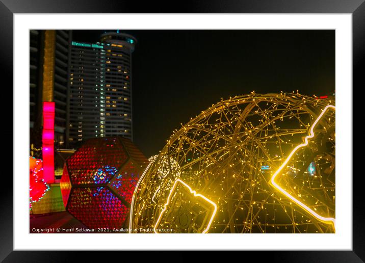 Colorful illuminated art with geometric shapes. Framed Mounted Print by Hanif Setiawan