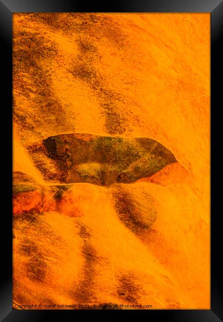Cave painting on orange cave wall. Framed Print by Hanif Setiawan
