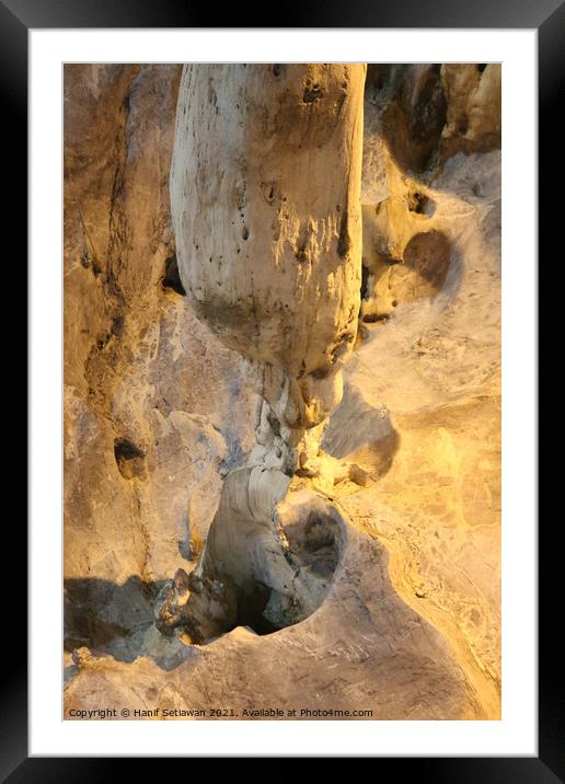 A gnome below a stalactite Framed Mounted Print by Hanif Setiawan