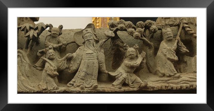 Buddhist bas-relief with sculptures of a family. Framed Mounted Print by Hanif Setiawan