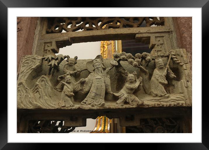 Buddhist bas-relief with sculptures of a family. Framed Mounted Print by Hanif Setiawan