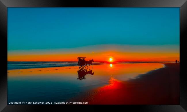 Horse-drawn carriage at sunset on beach Framed Print by Hanif Setiawan