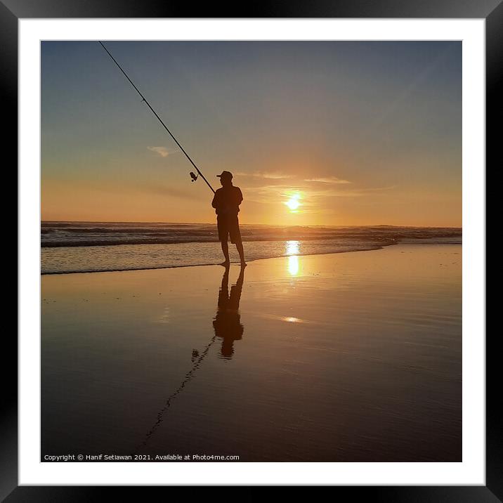 Fisherman on sand beach at sunset Squared Framed Mounted Print by Hanif Setiawan