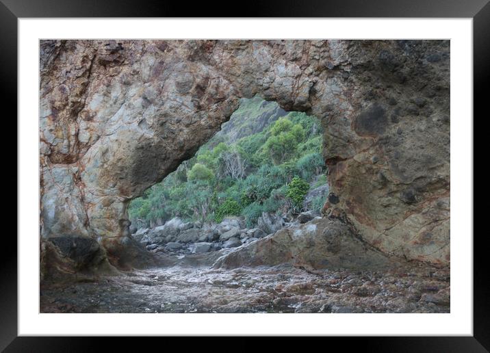 Frame view through a hole in a rock at a coast Framed Mounted Print by Hanif Setiawan