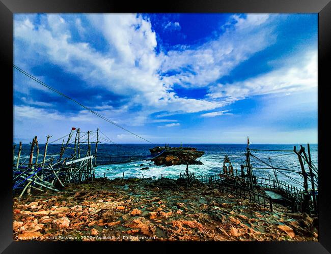 A rock plateau and a rock island in the sea 3 Framed Print by Hanif Setiawan