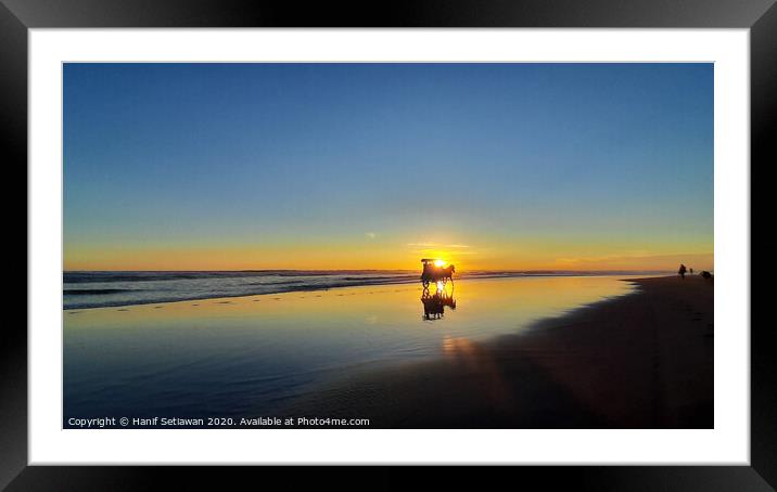 Silhouetted horse-drawn carriage beach sunset 3 Framed Mounted Print by Hanif Setiawan