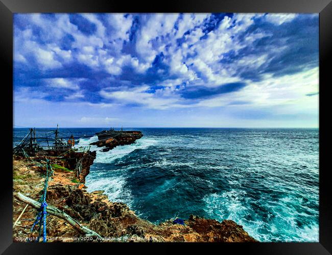 A rock plateau and a rock island in the sea 7 Framed Print by Hanif Setiawan