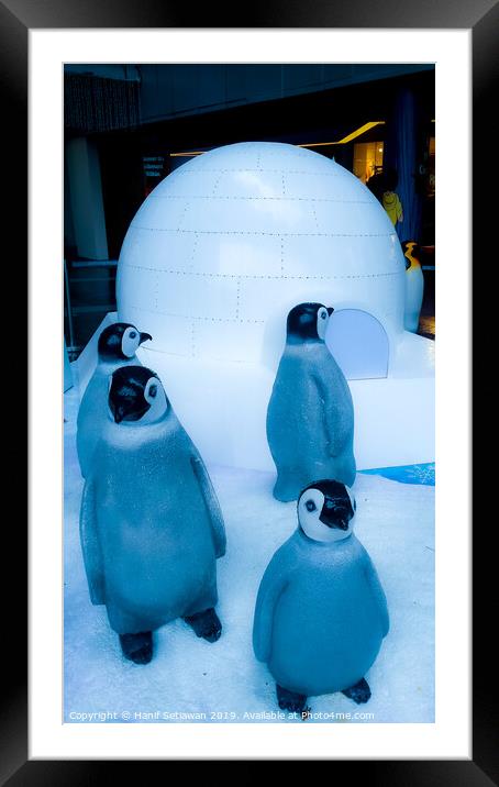 group of Penguin sculptures in front of an igloo 2 Framed Mounted Print by Hanif Setiawan