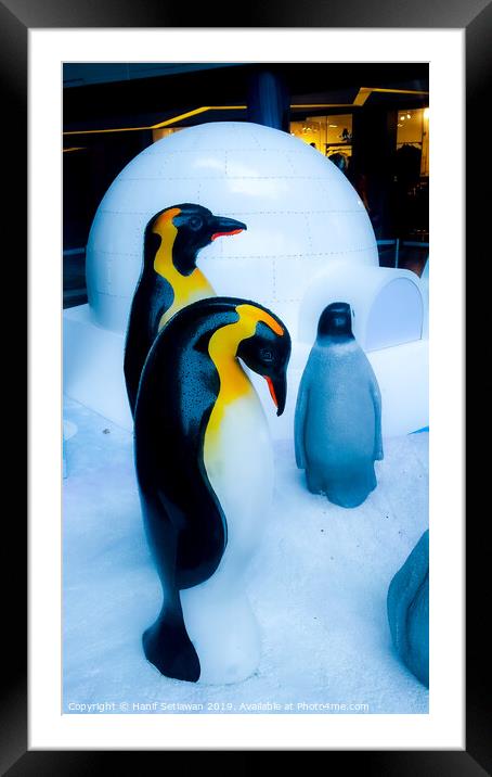 group of Penguin sculptures in front of an igloo 4 Framed Mounted Print by Hanif Setiawan