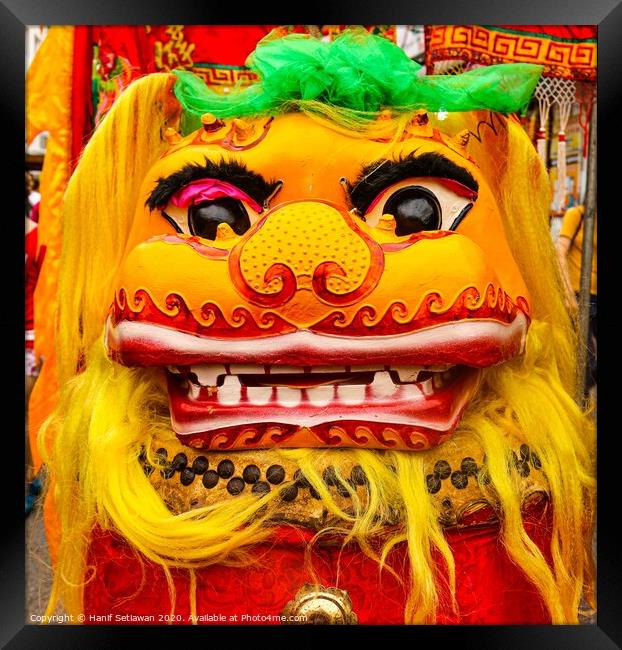 Golden red Chinese Dragon mask on a festival Framed Print by Hanif Setiawan