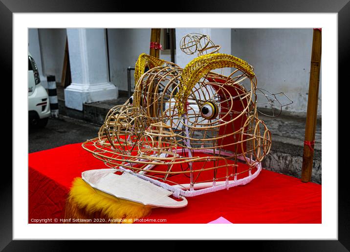 Unfinished grid Chinese Dragon mask on a festival  Framed Mounted Print by Hanif Setiawan