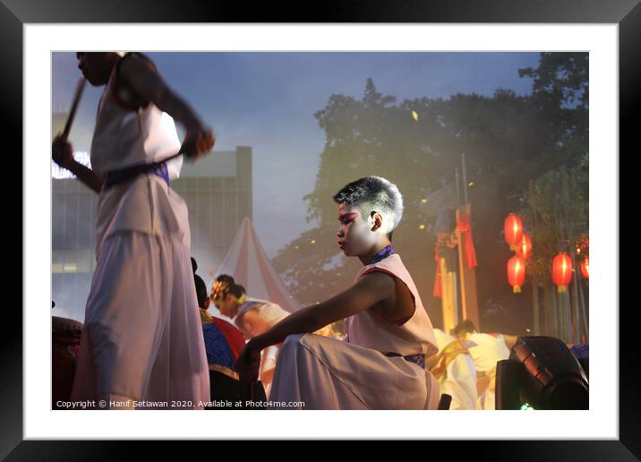 Young drummer performer on a culture festival. Framed Mounted Print by Hanif Setiawan